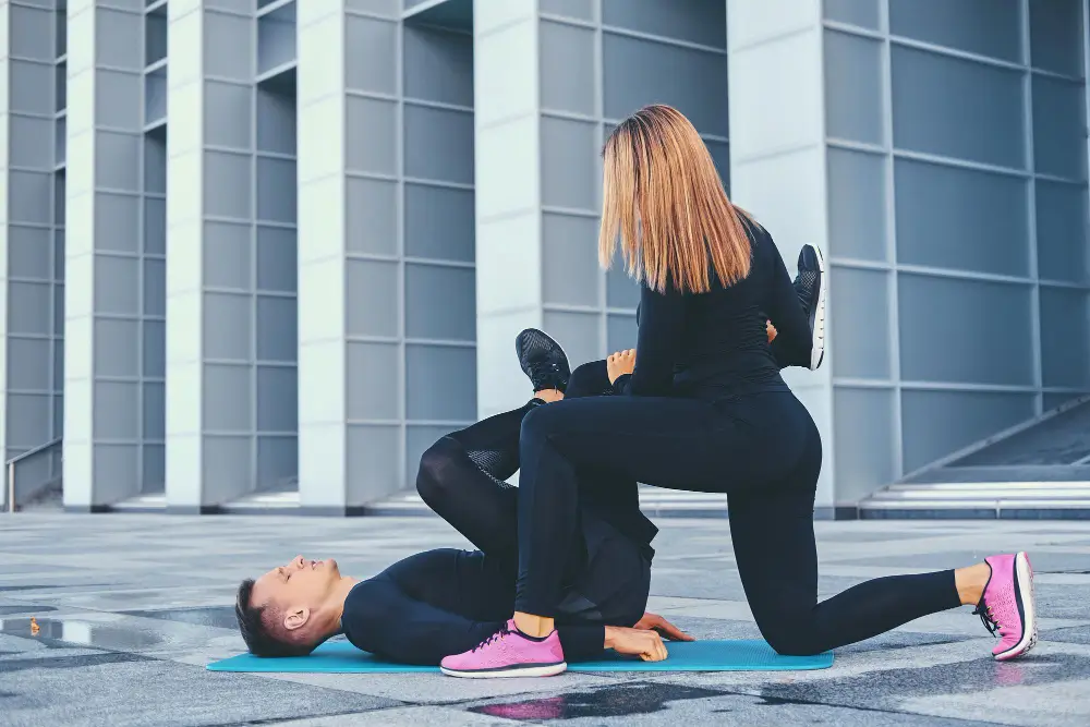 Doing Cool-down excersise with trainer